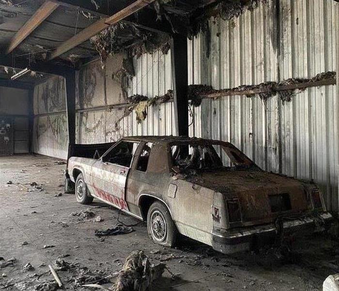 burned car in warehouse
