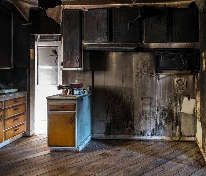 Image of home kitchen following house fire damage.