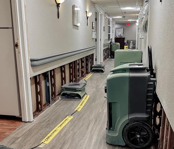 SERVPRO® equipment restoring water damage in a office